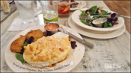Table 23 signature dishes Shrimp and GritsFried Green TomatoesPecan Crusted TroutPork Chop﻿﻿﻿﻿﻿
